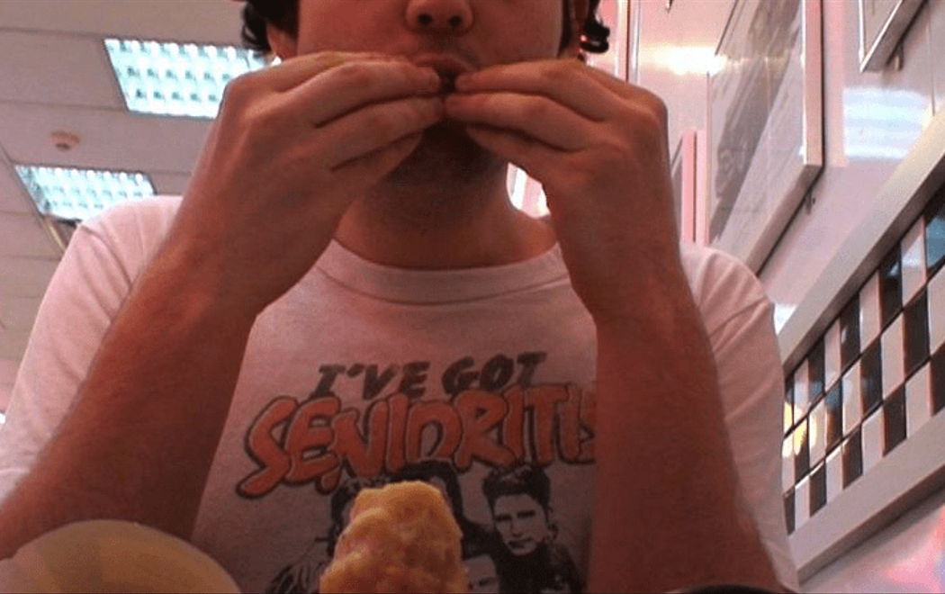 Campbell fills his mouth with Burger King chips